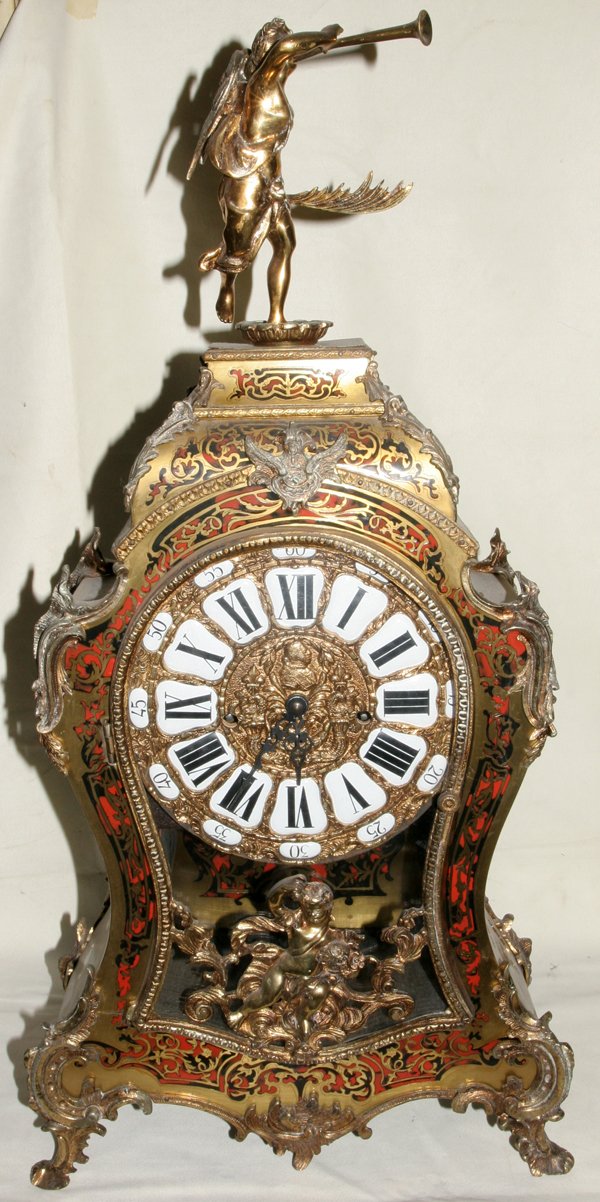 FRENCH BOULLE MANTEL CLOCK, C. 1900, H 29": "FRENCH BOULLE MANTEL CLOCK, C. 1900, H 29"", W 14"":Ormolu mounted with a winged angel finial. Having enamel dials with Roman numerals." (rev.20090417)