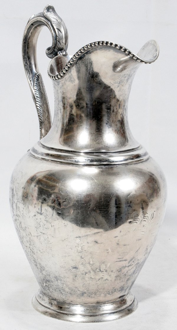 BAILEY, KETTELL & CHAPMAN COIN SILVER PITCHER: BAILEY, KETTELL & CHAPMAN COIN SILVER PITCHER, C. 1856, H 12":Classic urn-form with scroll handle and beaded rim, engraved "SSG, June 3rd 1856" at the body below the spout, stamped at the underside "B