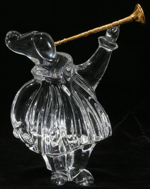 BACCARAT CRYSTAL FIGURE W/TRUMPET, JEAN BOGGIO: BACCARAT CRYSTAL FIGURE WITH TRUMPET BY JEAN BOGGIO, H 5 1/2":Columbine-like figure holding a gilt metal trumpet, signed by Jean Boggio with Baccarat trademark.