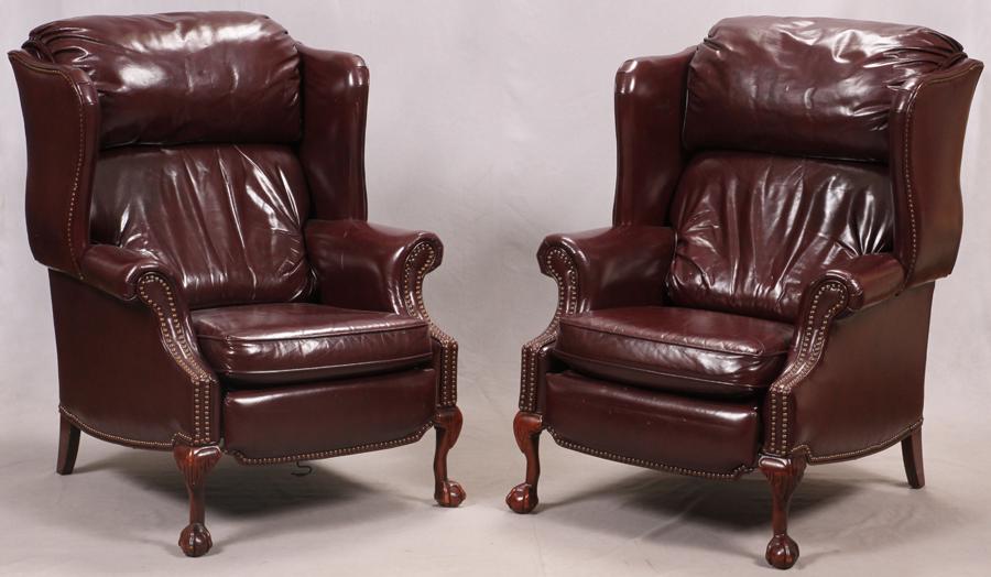 BARCALOUNGER BURGUNDY LEATHER CHIPPENDALE STLYLE ARM: BARCALOUNGER BURGUNDY LEATHER CHIPPENDALE STLYLE ARM CHAIRS PAIR H 43" W 31" Barcalounger.Chair tilts and footrest springs forward. Mahogany frames. Loose seat cushions.