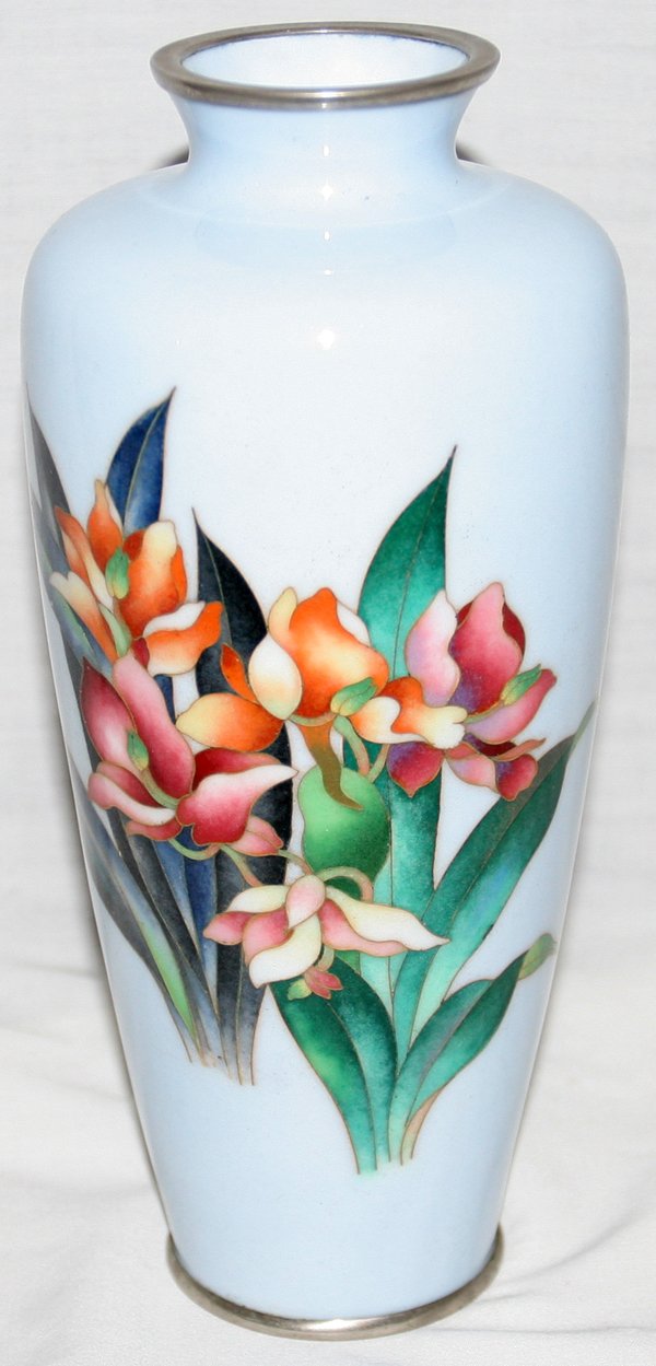JAPANESE CLOISONNÉ VASE, C. 1950-60, H 8 3/4": JAPANESE CLOISONNÉ VASE, C. 1950-60, H 8 3/4":Silver base. Multi-color garden flower motif against a pale blue/grey ground.