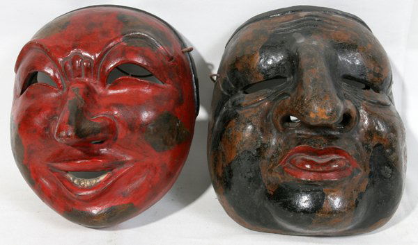 JAPANESE 'BUGAKU' LACQUER MASKS, W 6 3/4" & 7": JAPANESE 'BUGAKU' LACQUER MASKS, TWO, W 6 3/4" & 7":Including mask in colors of brown, black and red depicting a figure sticking his tongue out together with 1 mask, predominately of red with brown an