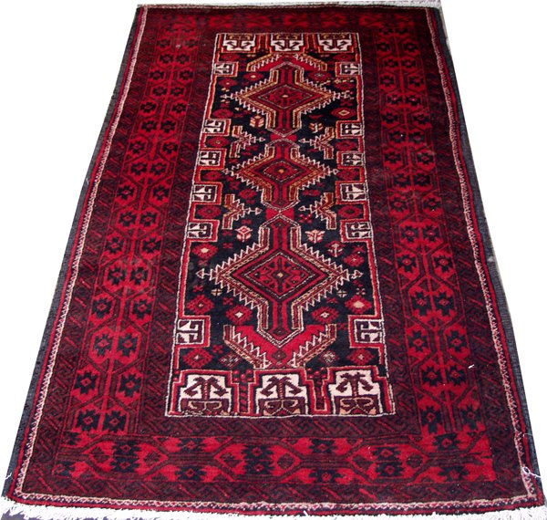 BALUCHISTAN WOOL RUG, 6' 1" X 3' 2": BALUCHISTAN WOOL RUG, 6' 1" X 3' 2":Geometric with dark blue, red and white medallions, floral and saw tooth motifs. Hand woven