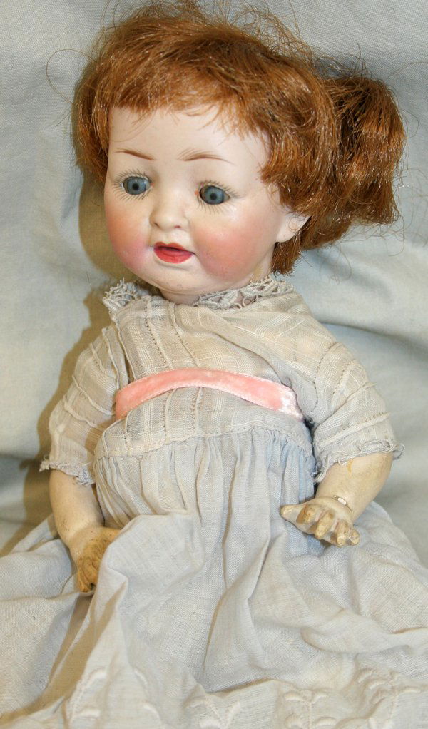 BISQUE HEAD "CRY BABY" GIRL DOLL, H 10": BISQUE HEAD "CRY BABY" GIRL DOLL, H 10":having open and close eyes, open mouth with teeth; unmarked; Ex collection Lila Johnson.