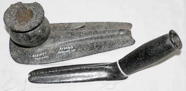 NATIVE AMERICAN HAND CARVED STONE PIPES, 2 PCS.: NATIVE AMERICAN HAND CARVED STONE PIPES, 2 PCS., L 7" - 8":one identified as a obtuse elbow pipe of steatite from Union Tenn.; the other having a bulbous bowl found near Athens, Mc Minn Co., Tenn.