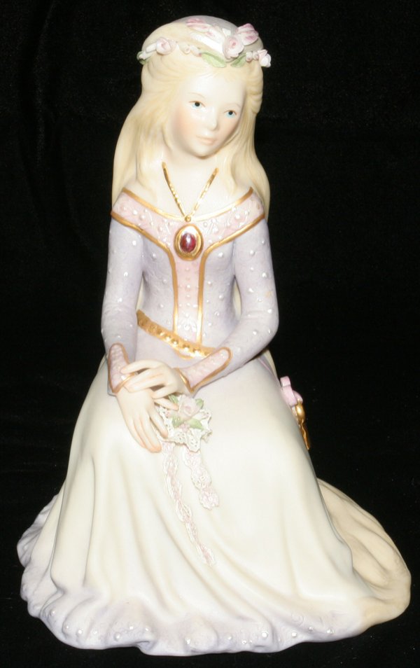CYBIS BISQUE FIGURE, 'RAPUNZEL', H 8": CYBIS BISQUE FIGURE, 'RAPUNZEL', H 8":Seated with hands clasped.