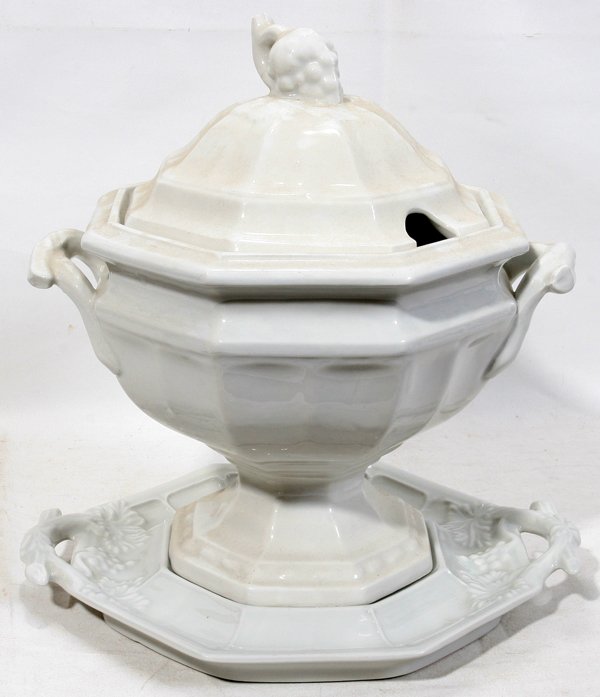 RED CLIFF IRONSTONE TUREEN & TRAY, H 12", : RED CLIFF IRONSTONE TUREEN & TRAY, H 12", L 11" & 12":The tureen is marked at the interior, incised, and the tray is marked in blue under glaze. Lot includes a damaged ladle. H 12", L 11" & 12 1/4".