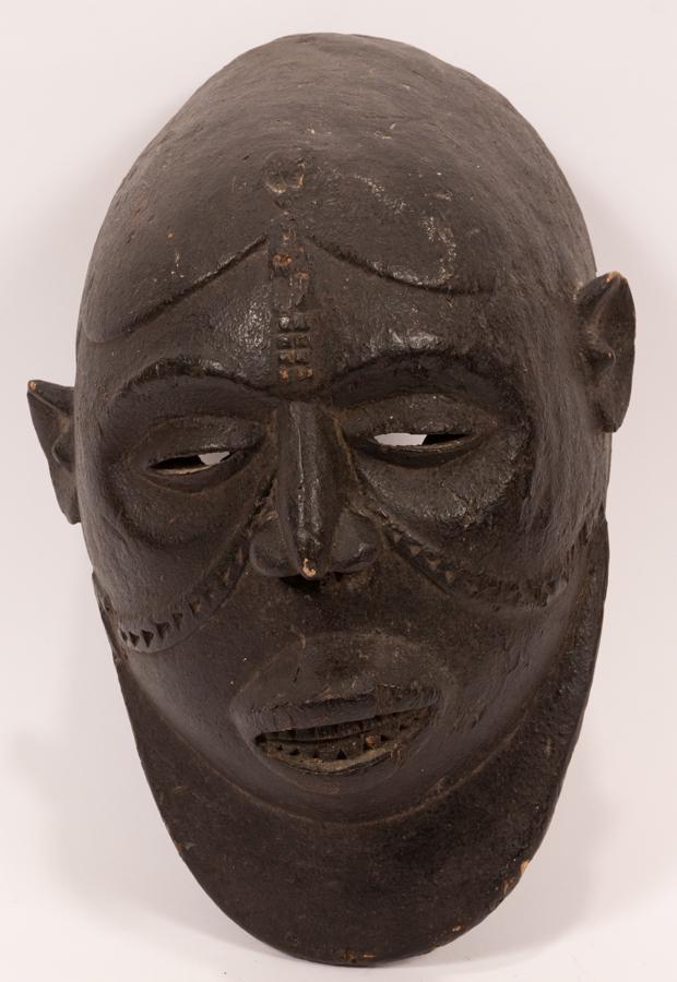IBIBIO, NIGERIA, AFRICAN PAINTED WOOD MASK H 17" W 10": IBIBIO, NIGERIA, AFRICAN PAINTED WOOD MASK H 17" W 10" D 7" Bearded faced with protruding lips and teeth, on a plexi stand.Provenance: Estate of Jack Faxon, Birmingham, MI. Michigan Senator and creato
