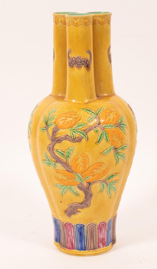 CHINESE 3-NECK VESSEL, H 10", DIA 5": CHINESE 3-NECK VESSEL, H 10", DIA 5"A Chinese three-neck vessel. Offers a yellow ground with pomegranates and bats in low relief. Maker's marks impressed to the underside. Accompanied with fitted box,