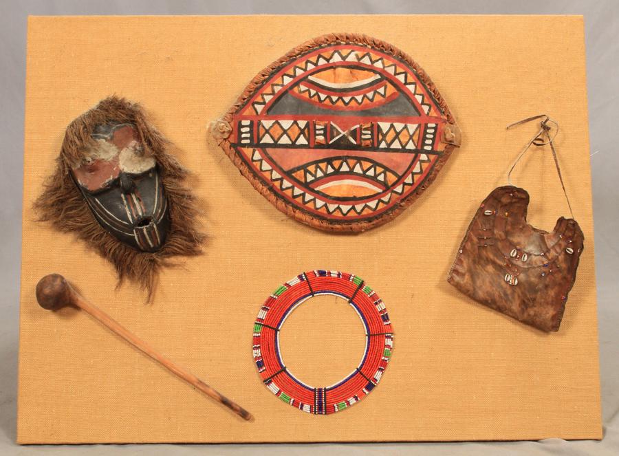 AFRICAN ARTIFACTS MOUNTED ON BURLAP PANEL, H 32", W 43" (1 of 5)