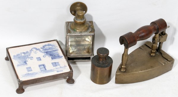 DUTCH POTTERY TILE-TRIVET; ANTIQUE BRASS IRON: DUTCH POTTERY TILE-TRIVET C. 1800; ANTIQUE BRASS IRON, 1 KILO BRASS WEIGHT, & LAMP:Under glaze blue motif of Dutch house. In footed iron frame. 5" x 5".Signed Spier. Hand made iron trivet frame. Also