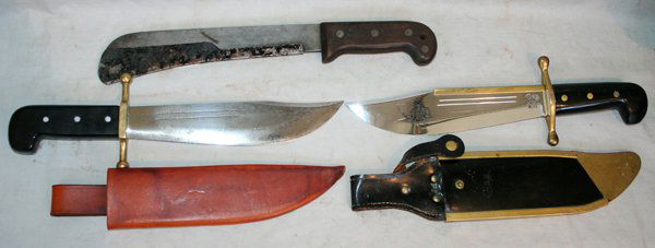 KINFOLK & CASE XX, V-44 MACHETE & BOWIE KNIVES,: KINFOLK & CASE XX, V-44 MACHETE & BOWIE KNIVES, C1940 & 60, 3 PCS., L 9" & 10" BLADES:includes a Kinfolk Bowie knife with black molded grips, leather sheath, 9" blade; a Case XX, V-44 machete, (no she