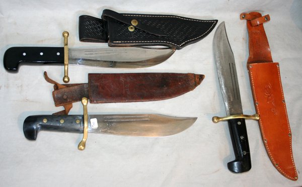 CASE XX, KINFOLK BOWIE KNIVES, C 1944, 3 PCS. : CASE XX, KINFOLK BOWIE KNIVES, C 1944, 3 PCS., L 9" BLADES:includes two Case XX Bowie knives 9" blades with leather sheaths; one Kinfolk Bowie knife with black leather sheath, 9 1/2" blade; all three 