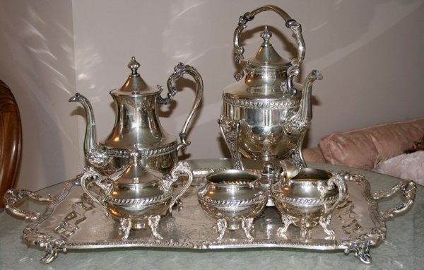 SHERIDAN SILVER CO. TEA SET WITH TRAY, SIX PCS: SHERIDAN SILVER CO. TEA SET WITH TRAY, SIX PIECES:Silverplate set includes 1 teapot, 1 hot water kettle on stand, 1 covered sugar bowl, 1 creamer, 1 waste bowl, and 1 tray, L.28". Mid 20th century.