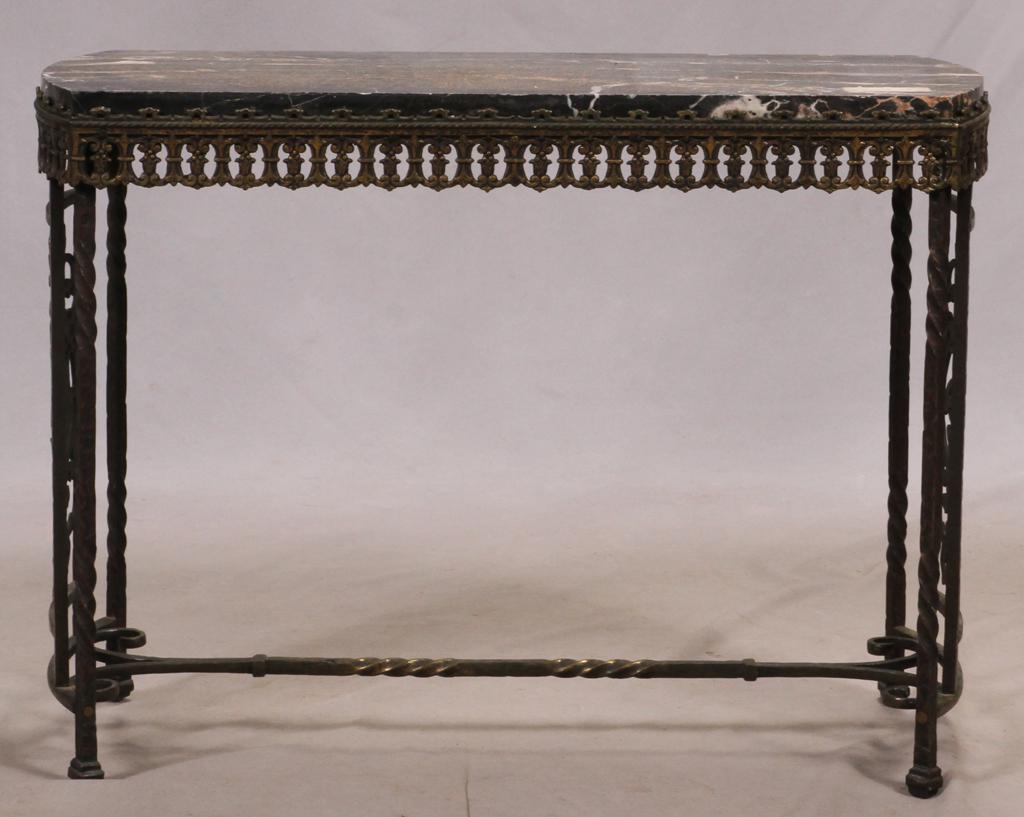 WROUGHT IRON, MARBLE TOP CONSOLE TABLE C 1920, H 21.5": WROUGHT IRON, MARBLE TOP CONSOLE TABLE C 1920, H 21.5" W 11.5" L 29" Black marble top with intentionally bowed ends, pierced lower gallery, with panels on both ends, two-masted sailing ship on ends. P