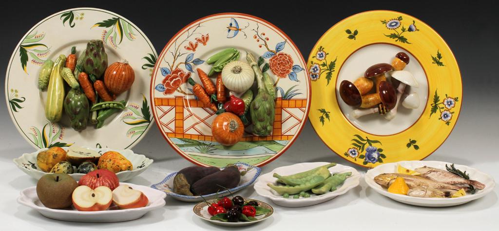FRENCH & ITALIAN TROMPE L'OEIL CERAMIC PLATES, 10 PCS,: FRENCH & ITALIAN TROMPE L'OEIL CERAMIC PLATES, 10 PCS, W 5.5"-13" A collection of ten trompe l'oeil ceramic plates. Features a cherry plate and fish plate by Christine Viennet, as well two mixed veget