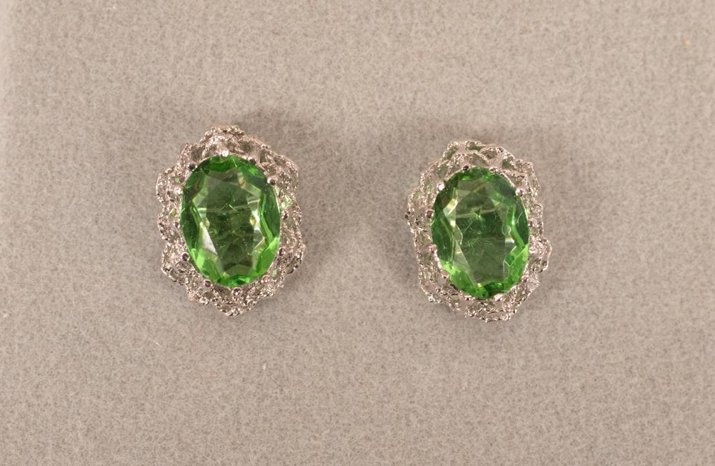 STERLING AND PERIDOT EARRINGS, GINORI: STERLING AND PERIDOT EARRINGS, GINORI Oval cut peridots in mint green. Sterling settings.