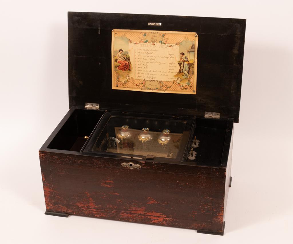 MUSIC BOX, C. 1920, H 8.5", W 19": MUSIC BOX, C. 1920, H 8.5", W 19" An early 20th century music box. Offers a repertoire of ten songs accompanied with a legend to the interior of the hinged lid. Plays beautifully.
