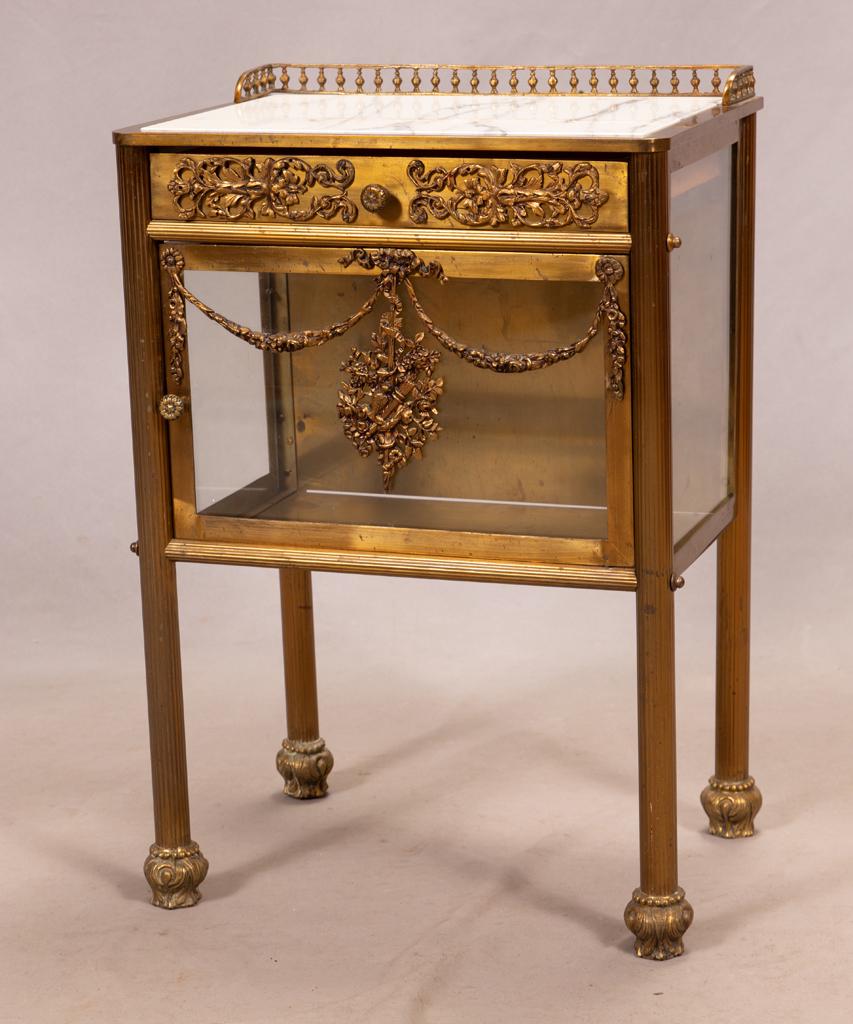 VIENNA BRASS AND MARBLE TOP NIGHT STAND: VIENNA BRASS AND MARBLE TOP NIGHT STAND Single drawer over door inset with crystal. From the estate of Jack Faxon, Birmingham, MI. Michigan Senator and creator of the Michigan Council for the Arts.