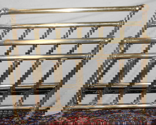 ANTIQUE BRASS BED FRAME: ANTIQUE BRASS BED FRAME, C. 1904-20, H 36"FOOT BOARD, 47" HEAD BOARD, W 56":On casters. By Sears Roebuck. with iron side rails