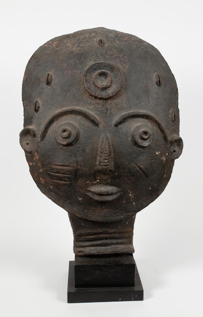 AFRICAN EARTHENWARE HEAD H 31" W 21" D 7": AFRICAN EARTHENWARE HEAD H 31" W 21" D 7" Estate of Jack Faxon, Birmingham, MI. Michigan Senator and creator of the Michigan Council for the Arts.