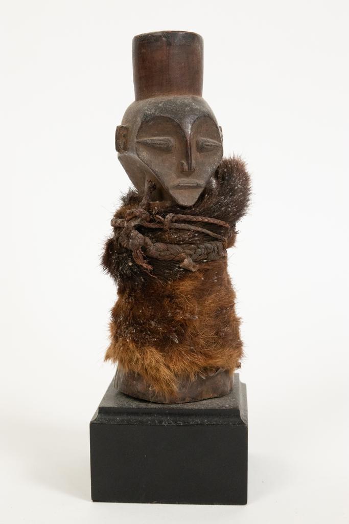 BANGOBANGO, AFRICAN CARVED WOOD, FIBER AND HIDE POWER: BANGOBANGO, AFRICAN CARVED WOOD, FIBER AND HIDE POWER FIGURE, H 8" DIA 3" Estate of Jack Faxon, Birmingham, MI. Michigan Senator and creator of the Michigan Council for the Arts.