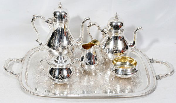 INTERNATIONAL SILVER CO. SILVER TEA SET, 6 PCS.: INTERNATIONAL SILVER CO. SILVER TEA SET, 6 PCS.:Georgian Court, pattern: silver plate, includes a tea pot, 11" H., coffee pot, 10" H., creamer, sugar, waste and tray, 27" L.;