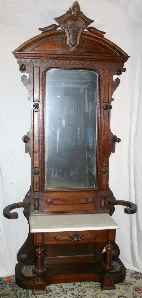 VICTORIAN WALNUT & BURL WALNUT HALL TREE,: VICTORIAN WALNUT & BURL WALNUT HALL TREE, C. 1870, H 92", W 44", D 15":Arched top with shield-form crest above a mirror flanked by five hat hooks, a beveled white marble top below and a single drawer