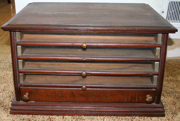 MAHOGANY SPOOL CHEST, H 13", W 21 3/4",: MAHOGANY SPOOL CHEST, H 13", W 21 3/4", D 16 1/2":Five drawers, one knob is missing. Marked Eureko spool silk on cabinet.