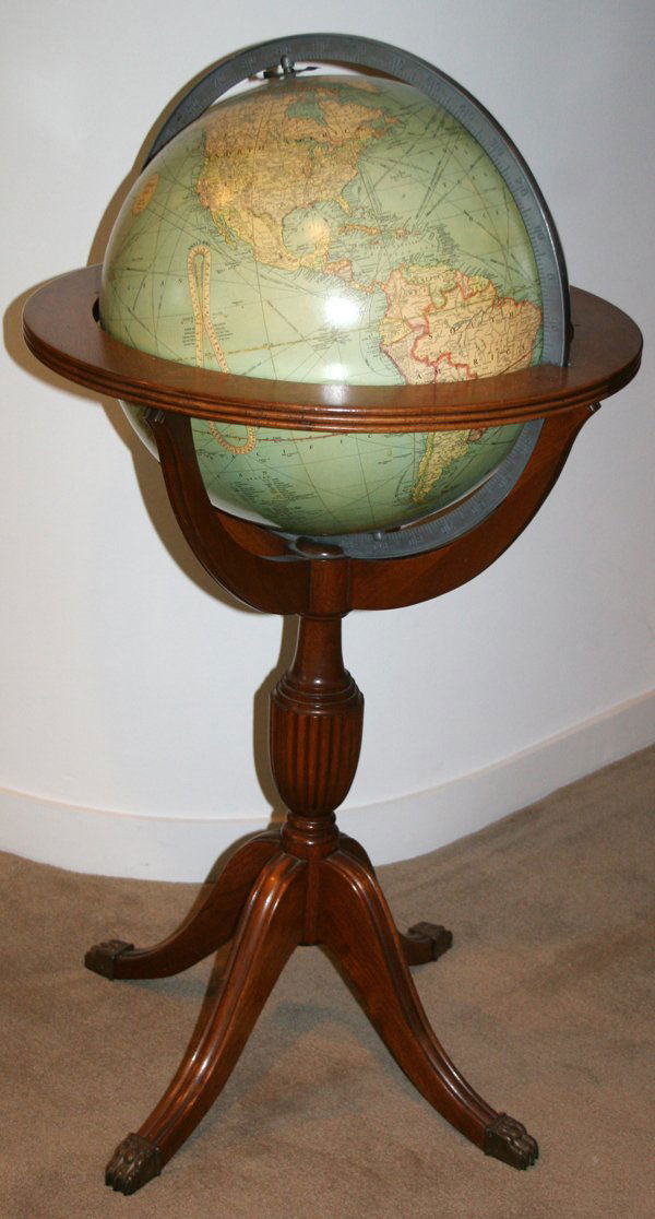 DUNCAN PHYFE STYLE GLOBE ON A MAHOGANY STAND: DUNCAN PHYFE STYLE GLOBE ON A MAHOGANY STAND, H 40", DIA 23":On brass claw feet.