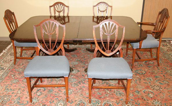 BAKER DINING TABLE & 6 CHAIRS, MAHOGANY: BAKER DINING TABLE & 6 CHAIRS, W 60", L 81", MAHOGANY:Having 5 side and 1 arm chair with blue upholstery. Also has one 31" leaf and table pads.