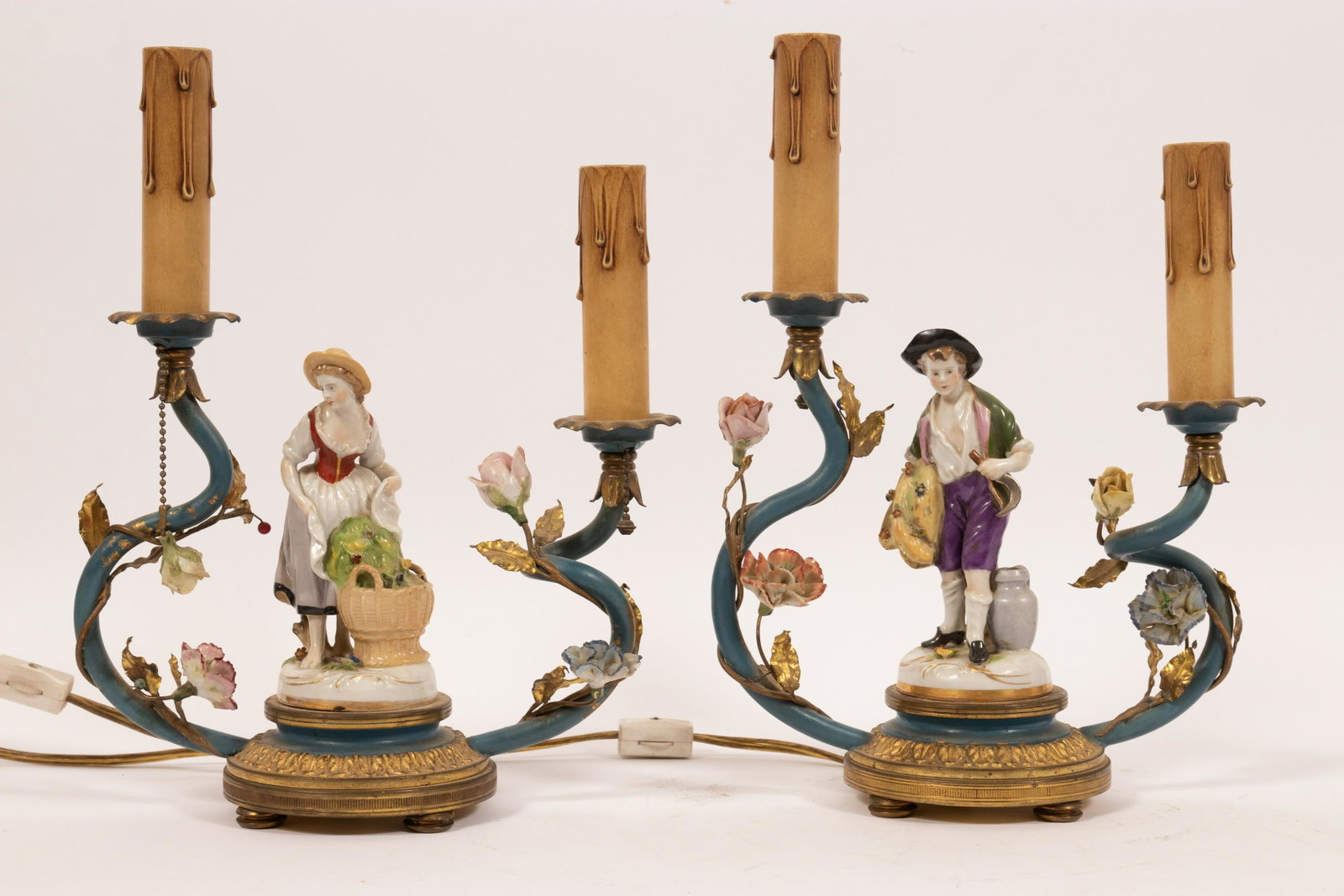 PORCELAIN FIGURES AND GILT METAL ELECTROLIERS PAIR H: PORCELAIN FIGURES AND GILT METAL ELECTROLIERS PAIR H 11" W 8" Hand painted figures mouned on gilt metal bases. Porcelain flowers in full relief. Two lights in each. From the estate of Gloria Anton, Gr