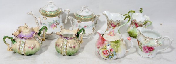 GERMAN PORCELAIN TEAPOT, SUGARS, CREAMERS: GERMAN PORCELAIN FLORAL TEAPOT, SUGARS, CREAMERS ANTIQUE, EIGHT, H 6",3 1/2":Three matching sets and two not matching.