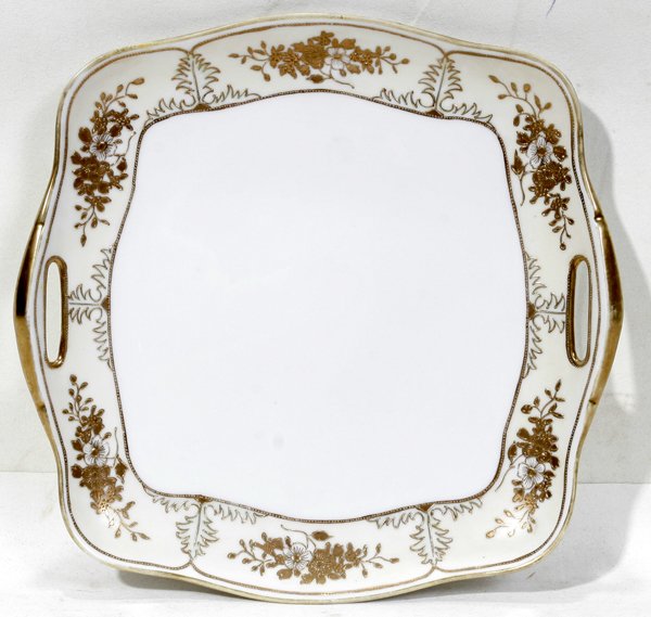 NIPPON PORCELAIN DESSERT TRAY, L 10", D 9 3/4": NIPPON PORCELAIN DESSERT TRAY, L 10", D 9 3/4":Having square form with slightly scalloped edge,the edge has gold trim and hand painted floral design.
