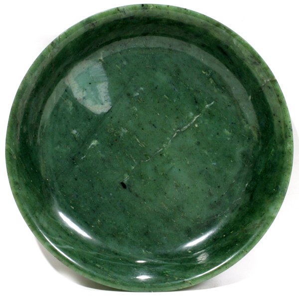 CHINESE JADE BUDDHIST ALTAR PLATE, 19TH C, : CHINESE JADE BUDDHIST ALTAR PLATE, 19TH CENTURY, H 2 1/4", DIA 12 1/2":Carved from one single jade piece. From the collection of Dulany's, Birmingham. Mich.