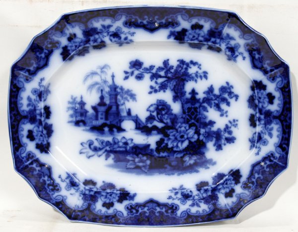 ENGLISH FLO BLUE 'SOBRAON' PLATTER, C. 1840, : ENGLISH FLO BLUE 'SOBRAON' PLATTER, C. 1840, L 16":Deep blue under glaze decoration, depicting a temple and lush landscape at the well. English Staffordshire, circa 1840, L.16 1/4" x 12 1/2".