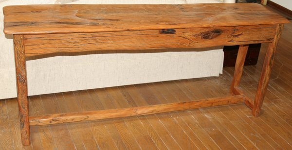 AFRICAN YELLOW WOOD CONSOLE TABLE, H 30", W 71": AFRICAN YELLOW WOOD CONSOLE TABLE, H 30", W 71", D 17":Trestle style base. Hand-crafted in Africa of exotic yellow wood. Contemporary; From the Collection of Alfred S. Warren.