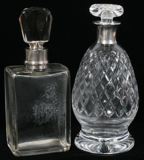 ENGLISH CRYSTAL & STERLING DECANTERS (2), H 10": ENGLISH CRYSTAL & STERLING DECANTERS (2), BIRMINGHAM, H 10":Including 1 Edwardian decanter, rectangular shape with etched monogram at one side, faceted stopper, and sterling silver collar with hallmar