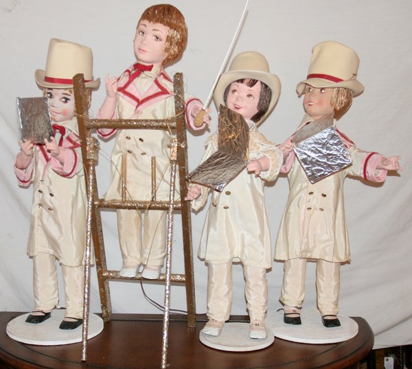 CHRISTMAS CAROLERS SET OF FOUR, ANTIQUE: CHRISTMAS CAROLERS SET OF FOUR, ANTIQUE, H 32" - 36", AUTOMATON:Paper Mache carolers, include conductor 32" on step ladder and three choir singers 36". Automaton, electric control.