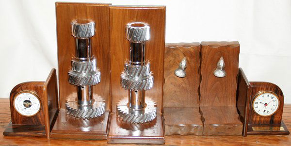 ROSEWOOD BOOKENDS & TWO OTHER PAIRS: ROSEWOOD BOOKENDS & TWO OTHER PAIRS:Rosewood bookends inset with clock and barometer and have small brass presentation plaque. Pair bookends with duck head motif. Pair bookends decorated with industri
