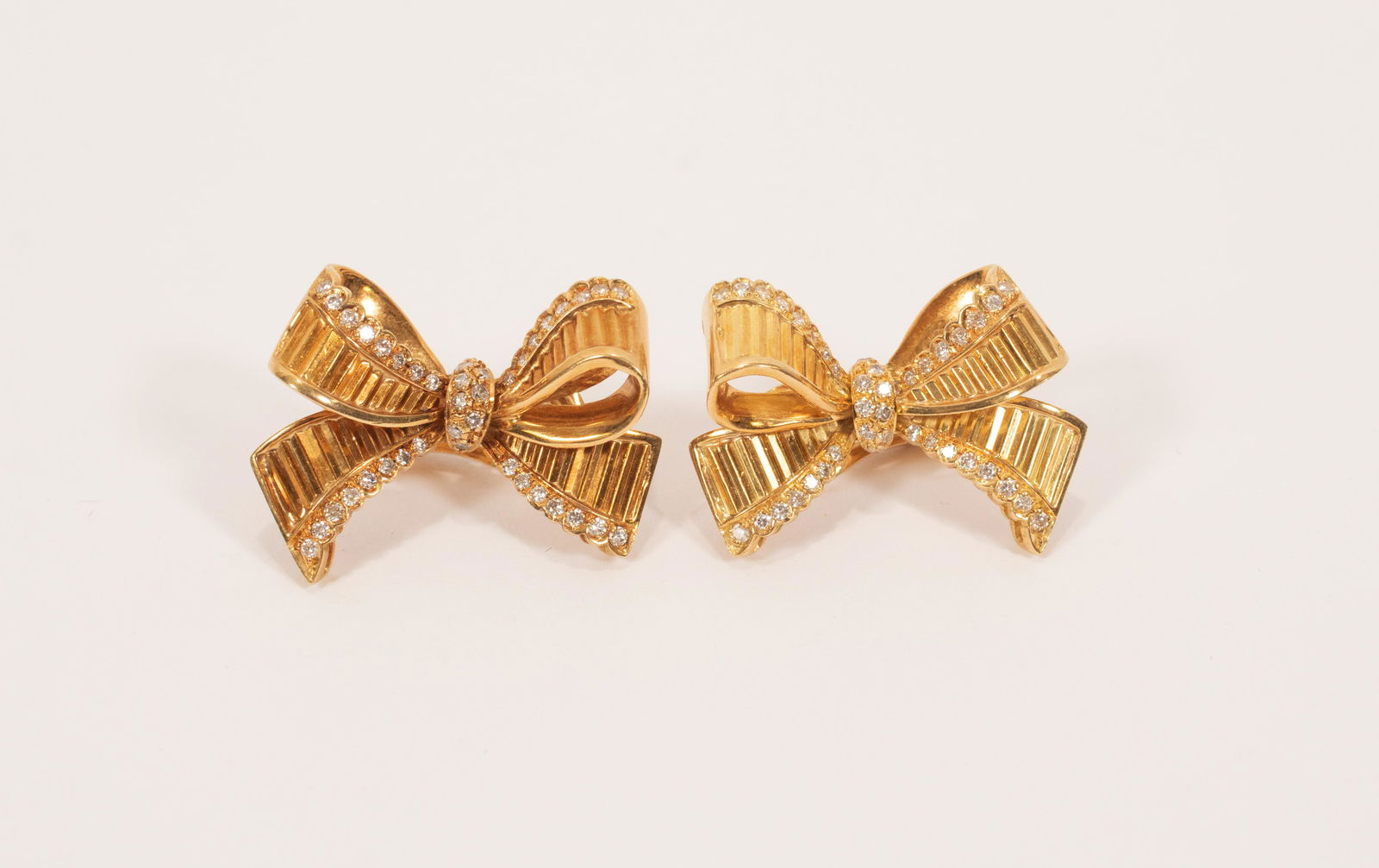 18KT YELLOW GOLD AND DIAMOND BOW FORM EARRINGS (1 of 3)