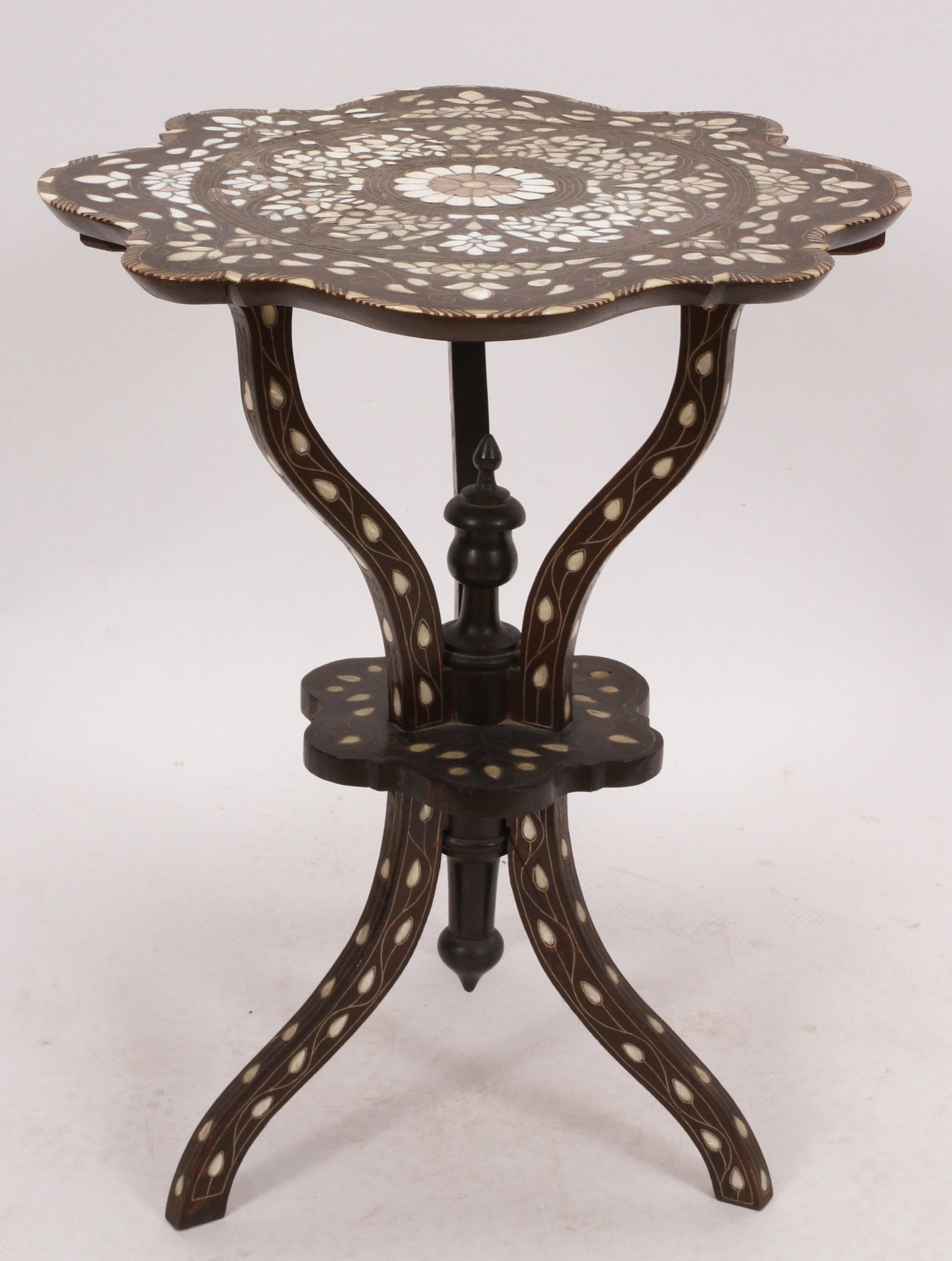 SYRIAN DAMASCUS BONE & MOTHER OF PEARL INLAID TABLE, C.: SYRIAN DAMASCUS BONE & MOTHER OF PEARL INLAID TABLE, C. 1900, H 29", DIA 24"A circa 1900 Syrian bone and mother of pearl inlaid table. Having a symmetrical design. Provenance: A Bloomfield Hills, MI c
