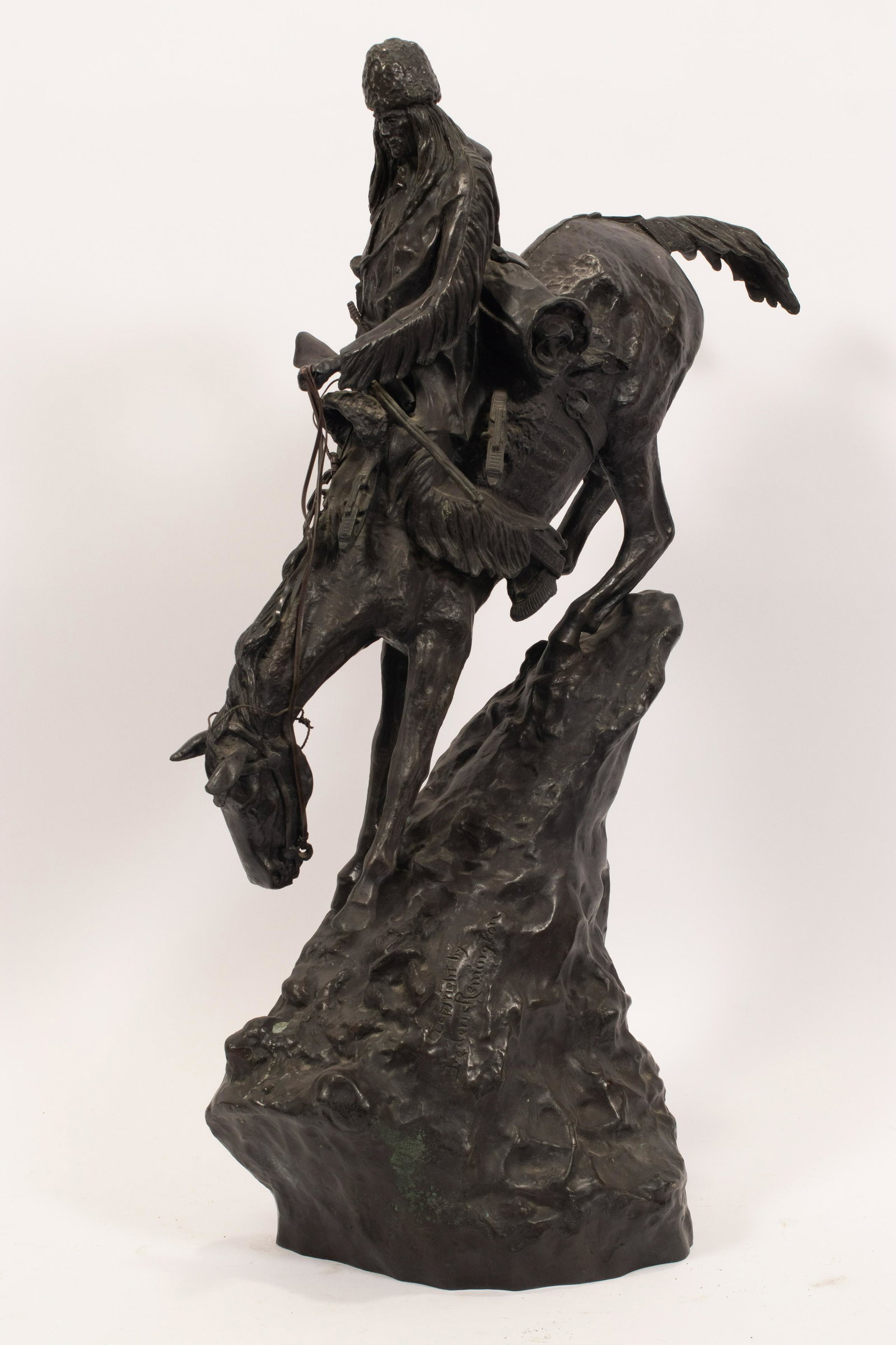 AFTER FREDERIC REMINGTON (AMERICAN, 1861-1909) BRONZE: AFTER FREDERIC REMINGTON (AMERICAN, 1861-1909) BRONZE SCULPTURE, H 28", W 15", "MOUNTAIN MAN" A bronze sculpture after Frederic Remington's "Mountain Man" (1903). Artist's signature and copyright to t