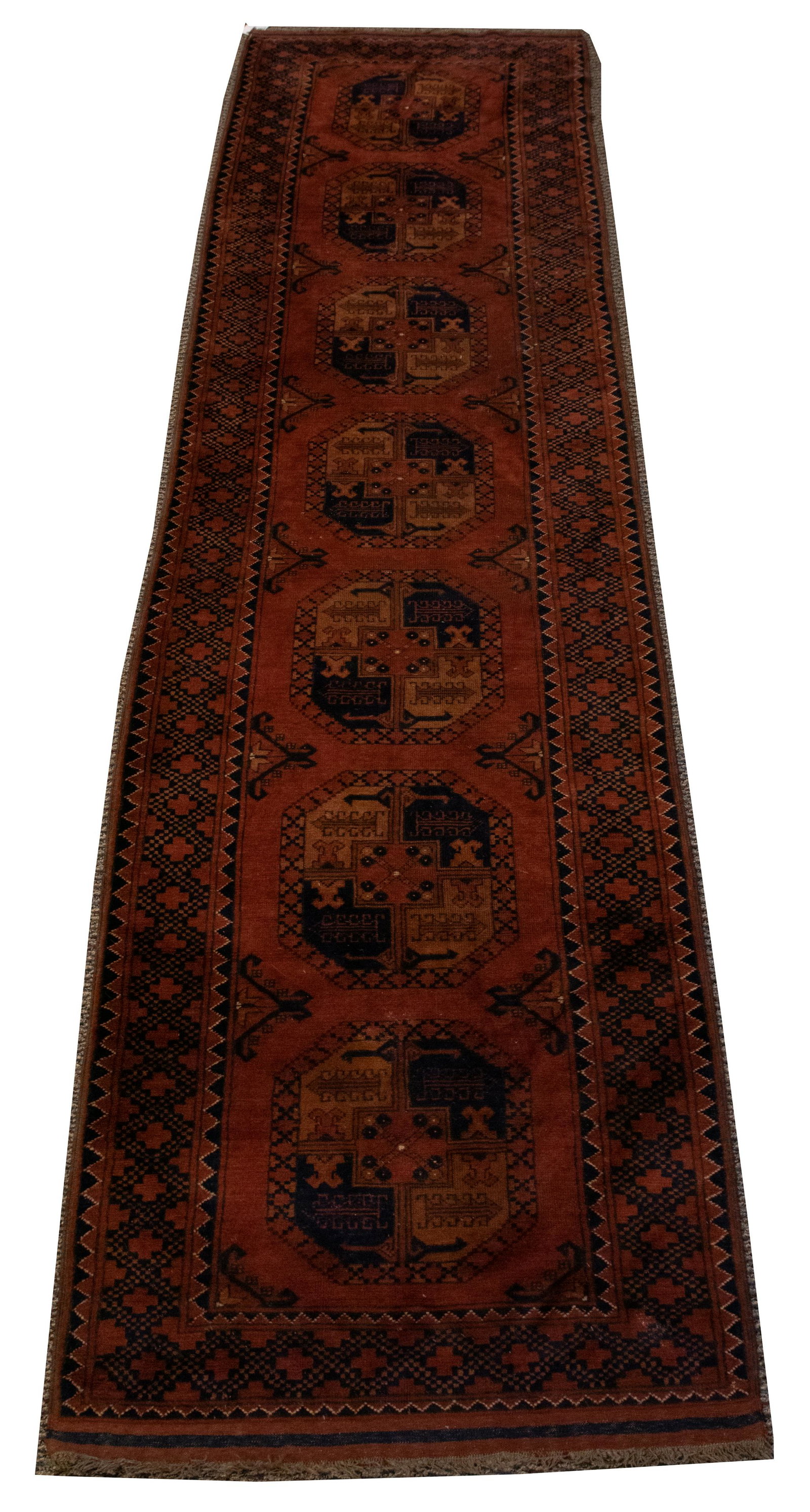 PAKISTAN BELUCHISTAN WOOL RUNNER, W 3' 2", L 12' 1": PAKISTAN BELUCHISTAN WOOL RUNNER, W 3' 2", L 12' 1" A Pakistani Balochistan wool runner. Boasting a palette of rust, navy and orange tones.