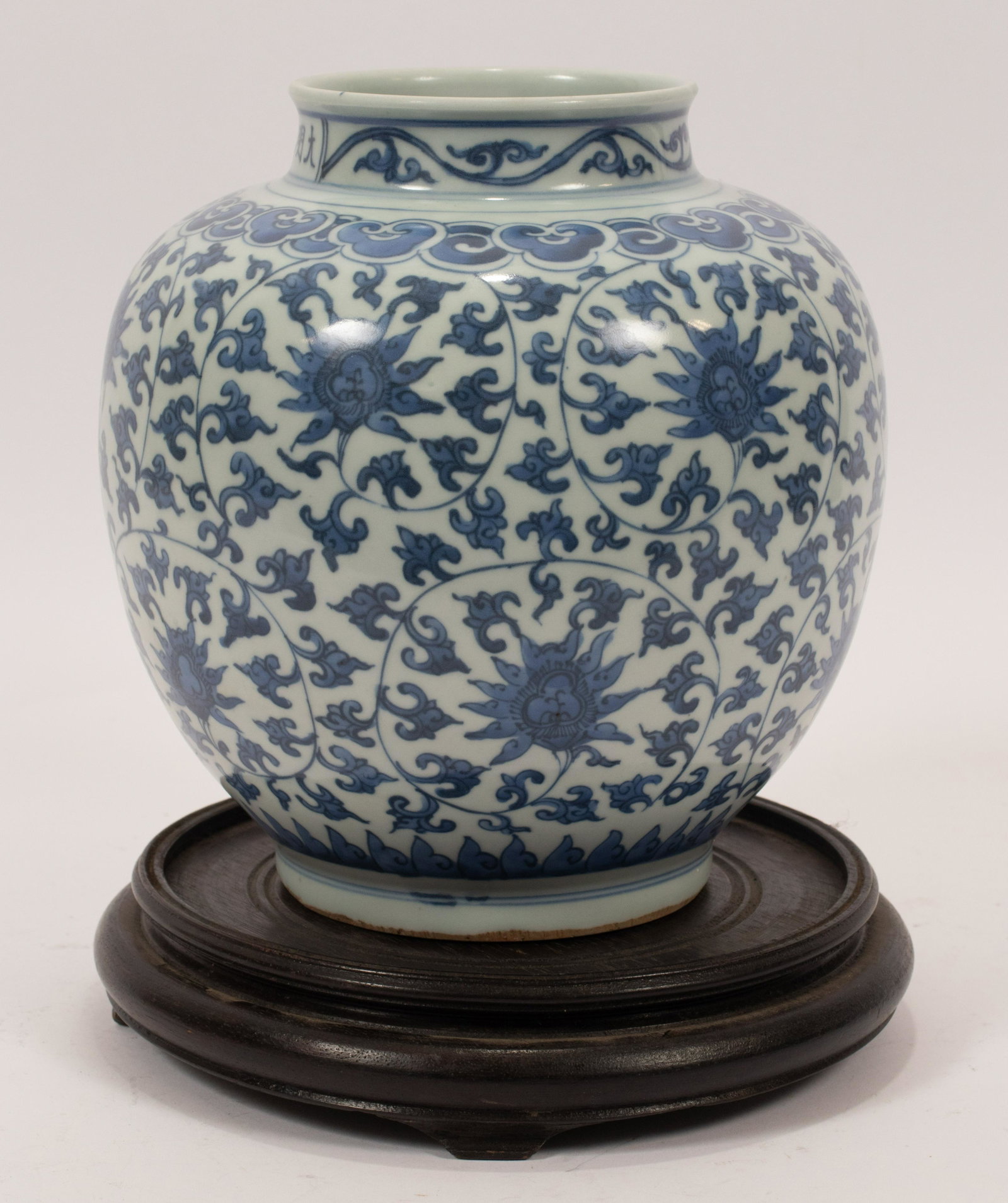 CHINESE BLUE & WHITE PORCELAIN JAR, H 8.5", DIA 8": CHINESE BLUE & WHITE PORCELAIN JAR, H 8.5", DIA 8" A Chinese blue and white porcelain jar. Having a Mah John Oriental Antiques (New York) paper label to the underside. Accompanied with stained wood st