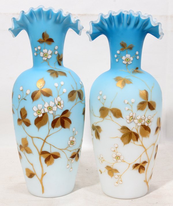 WEBB GLASS VASES, 19TH C, PAIR, H 13", DIA 4": WEBB GLASS VASES, 19TH CENTURY, PAIR, H 13", DIA 4":Each has a ruffled rim and blue to white satin glass with enamel decoration of leaves and flowers. The underside of each has the acid-etched signatu