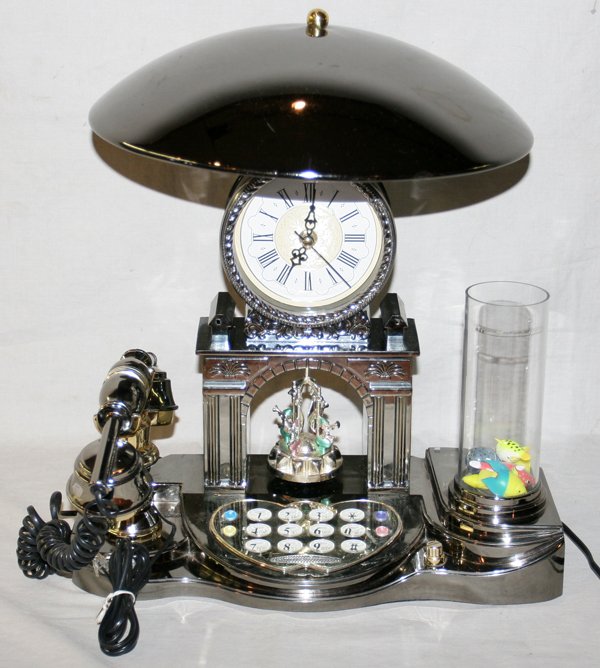 TELEPHONE TABLE LAMP WITH CLOCK AND VASE H 13": TELEPHONE TABLE LAMP WITH CLOCK AND VASE H 13", L 15":Plastic and metal. D 6".