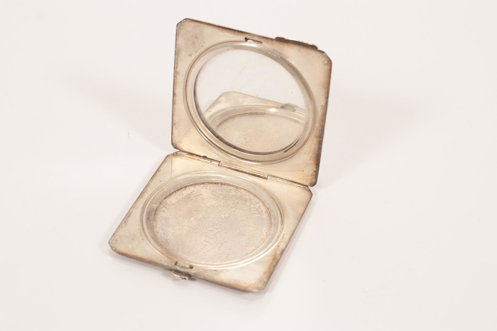 STERLING COMPACT, BIRKS W 2.5": STERLING COMPACT, BIRKS W 2.5" hand engraved hinged cover. Opens to mirror and powder case.Impressed "Birks" Canada and "Sterling". Circa 1920.