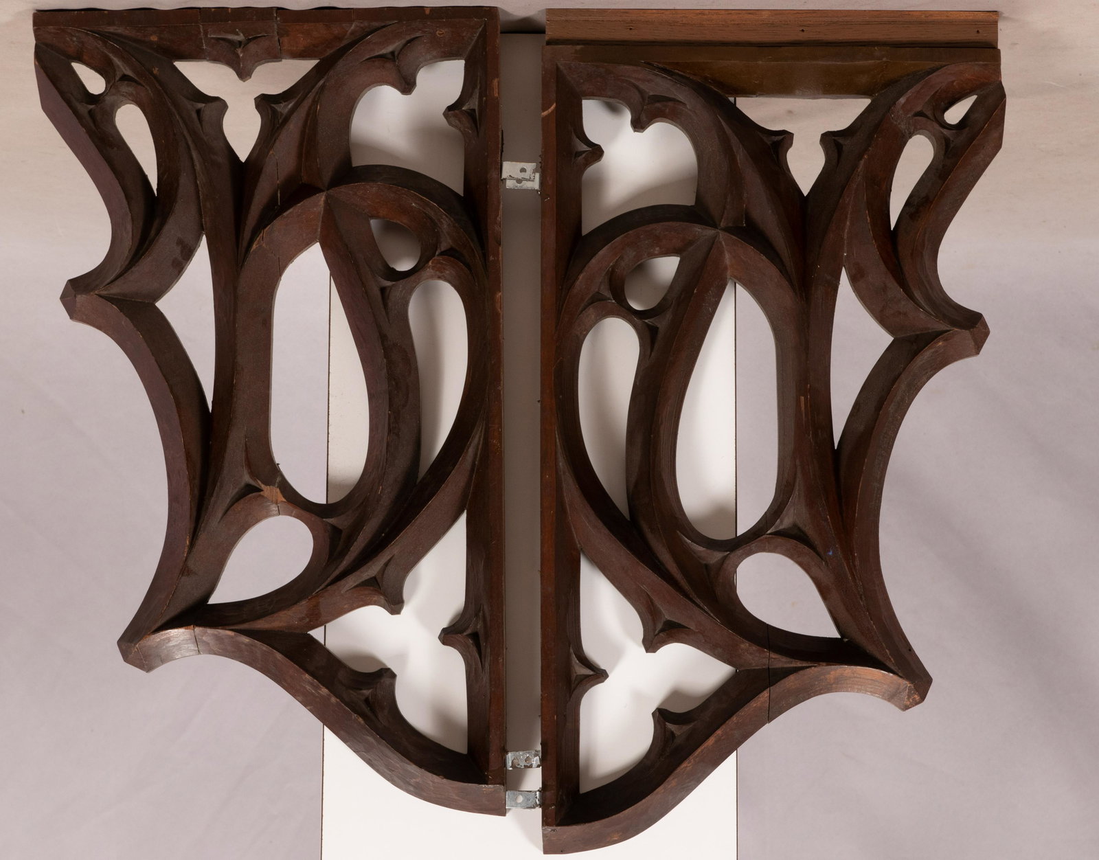 CARVED WOOD WALL ORNAMENTS PAIR H 13.5" W 23.5": CARVED WOOD WALL ORNAMENTS PAIR H 13.5" W 23.5" each with metal mounting brackets. Estate of Jack Faxon, Birmingham, MI. Michigan Senator and creator of the Michigan Council for the Arts.From the esta