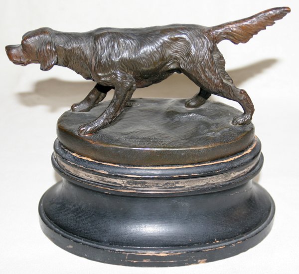ANTONIO PICCIOLA, BRONZE SCULPTURE, H 5", L 9",: ANTONIO PICCIOLA, BRONZE SCULPTURE, H 5", L 9", 'JOE CUMMING 1899':depicts a hunting dog on point; "1909 DuPont trophy" on base. On a turned wood plinth original to the bronze, H.4", L.8 1/2". From th